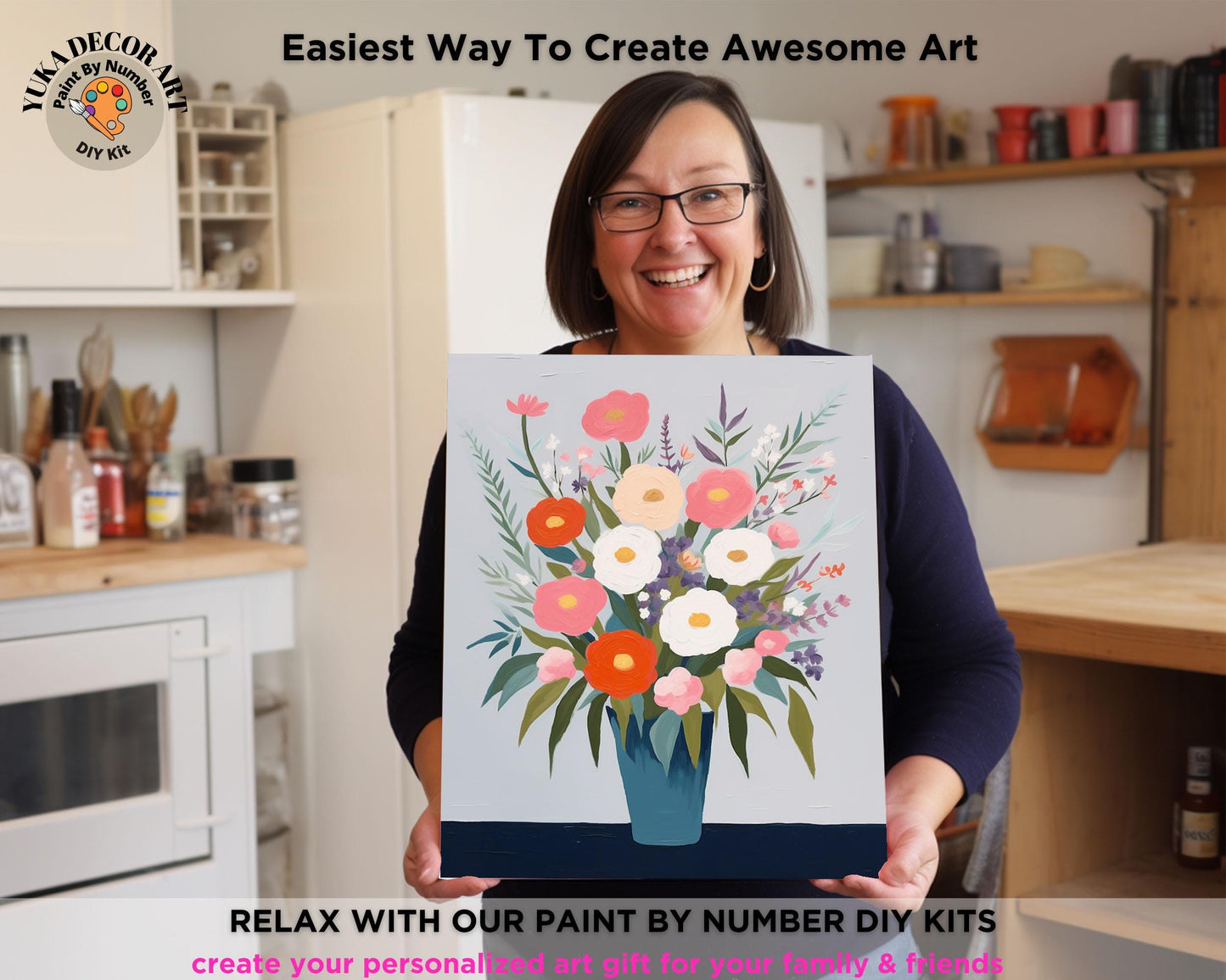 a woman holding a painting of flowers in a vase