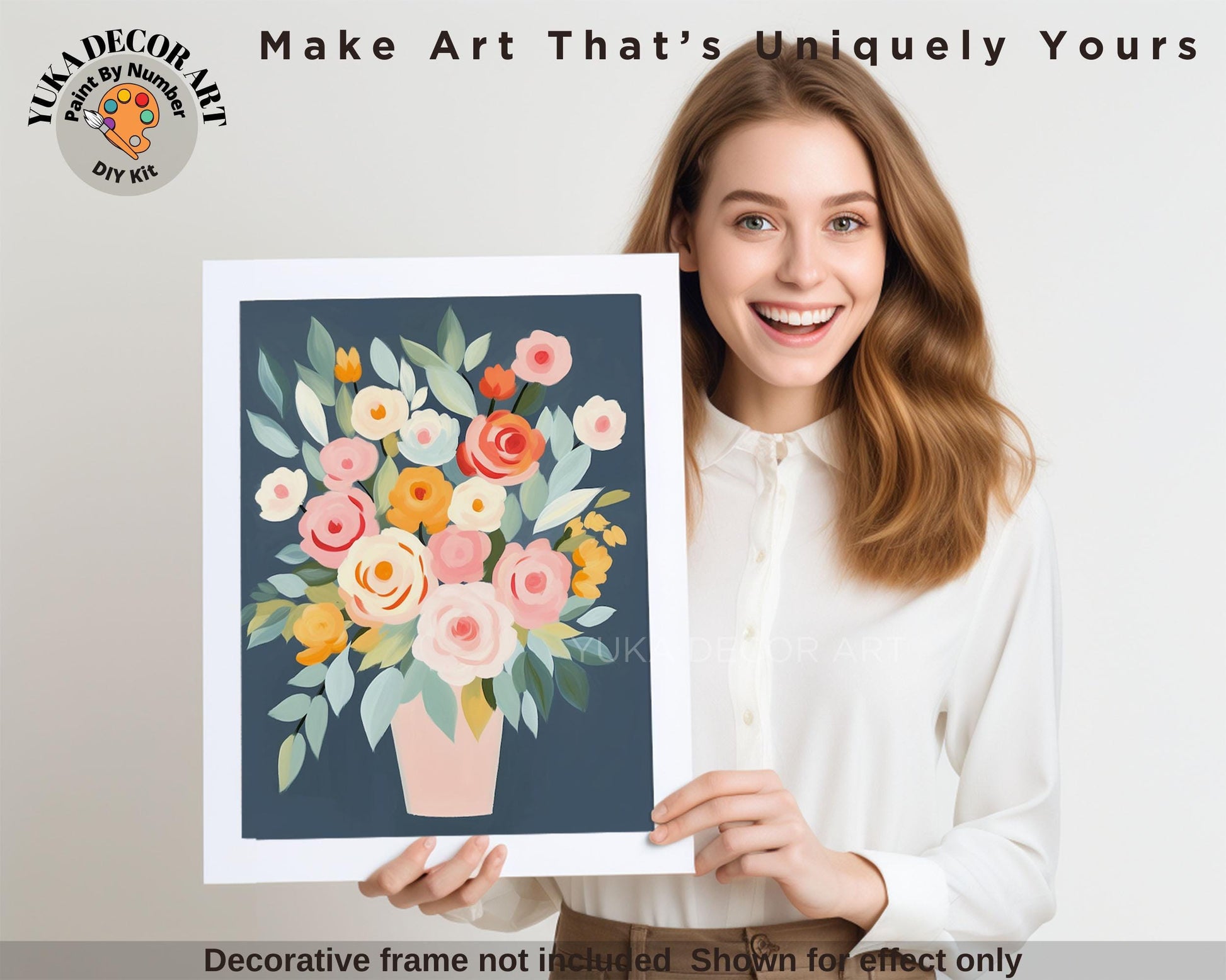 a woman holding a picture of a vase of flowers