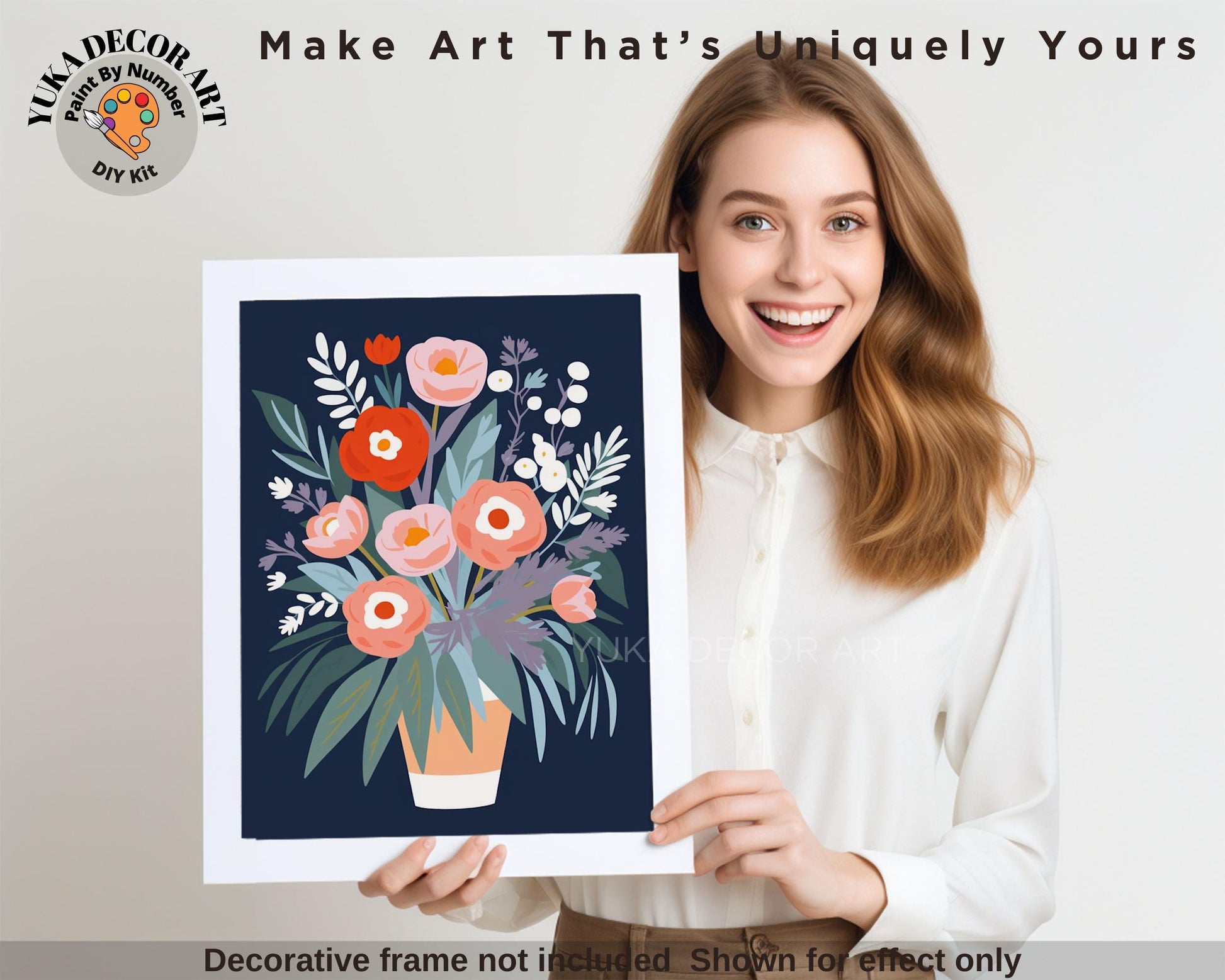 a woman holding up a picture of a vase of flowers