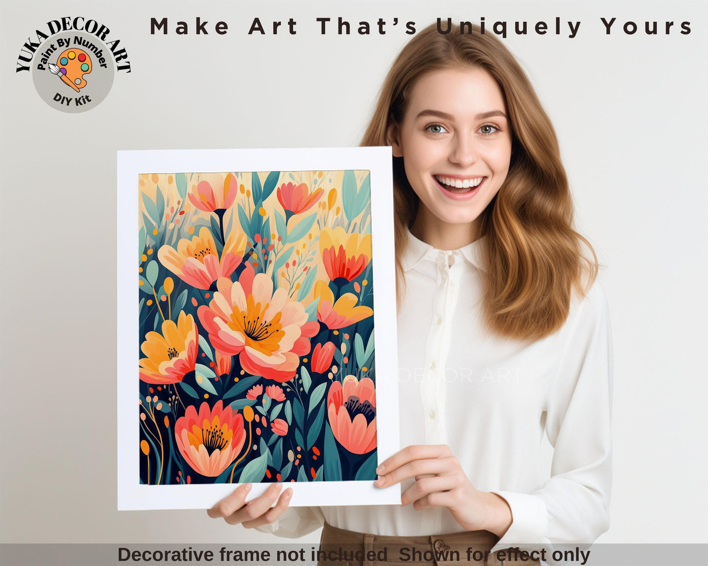a woman holding up a picture of flowers
