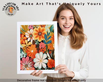 a woman holding up a picture of flowers
