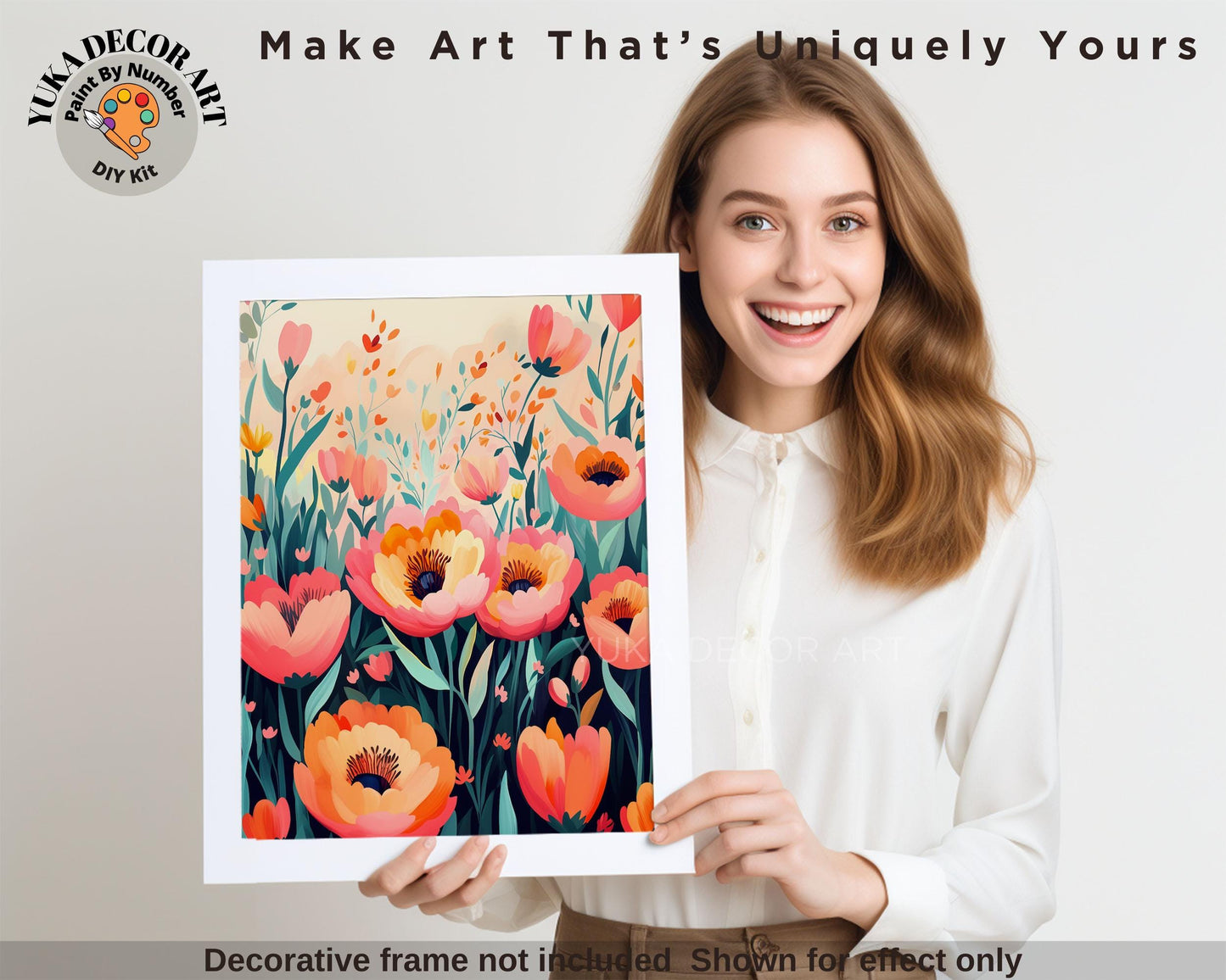 a woman holding up a picture of flowers