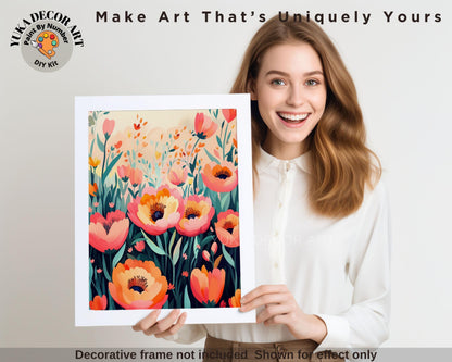 a woman holding up a picture of flowers